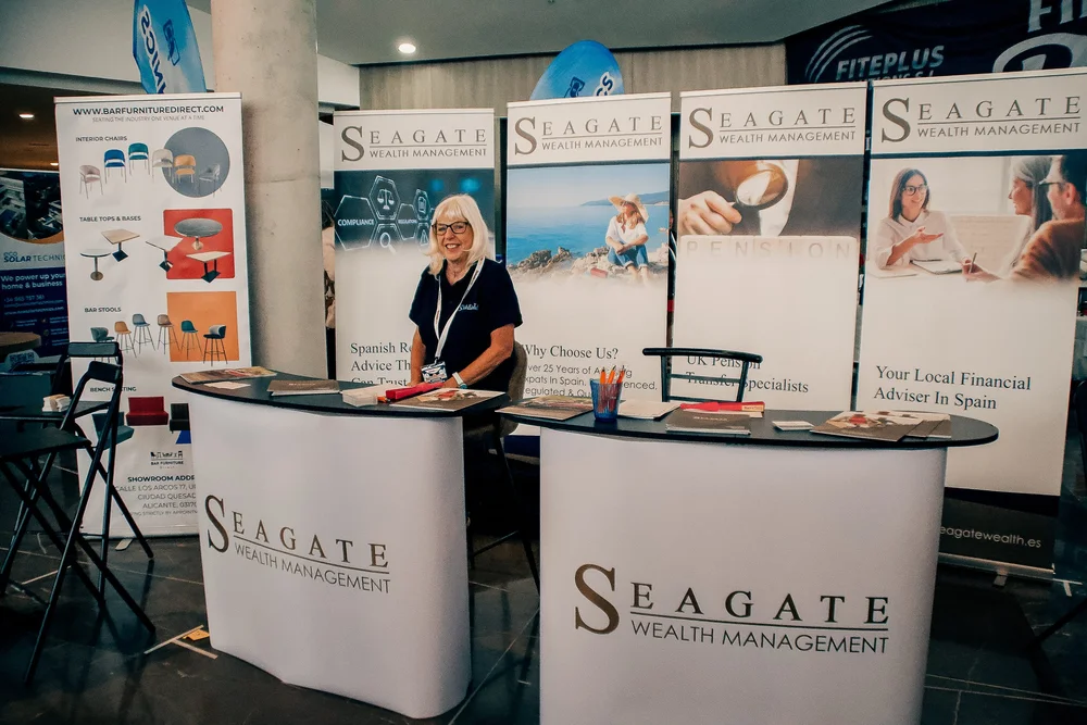 Seagate Wealth Management stand with certified financial advisors in Spain