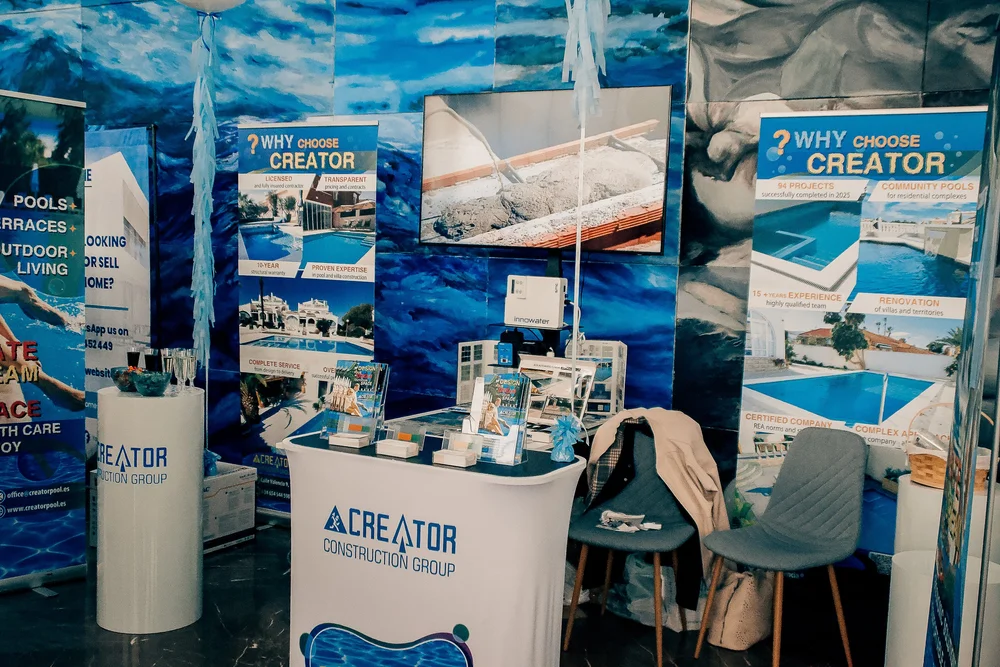 Creator Construction Group stand showing luxury pool installations and terrace renovations