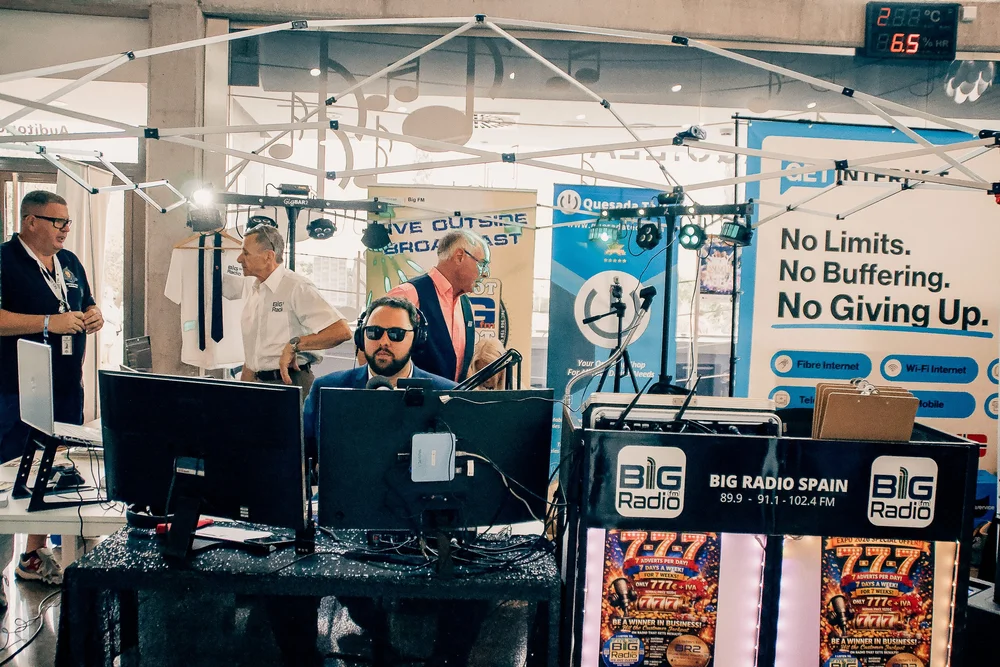 Big Radio Spain presenter broadcasting live interviews from the exhibition floor