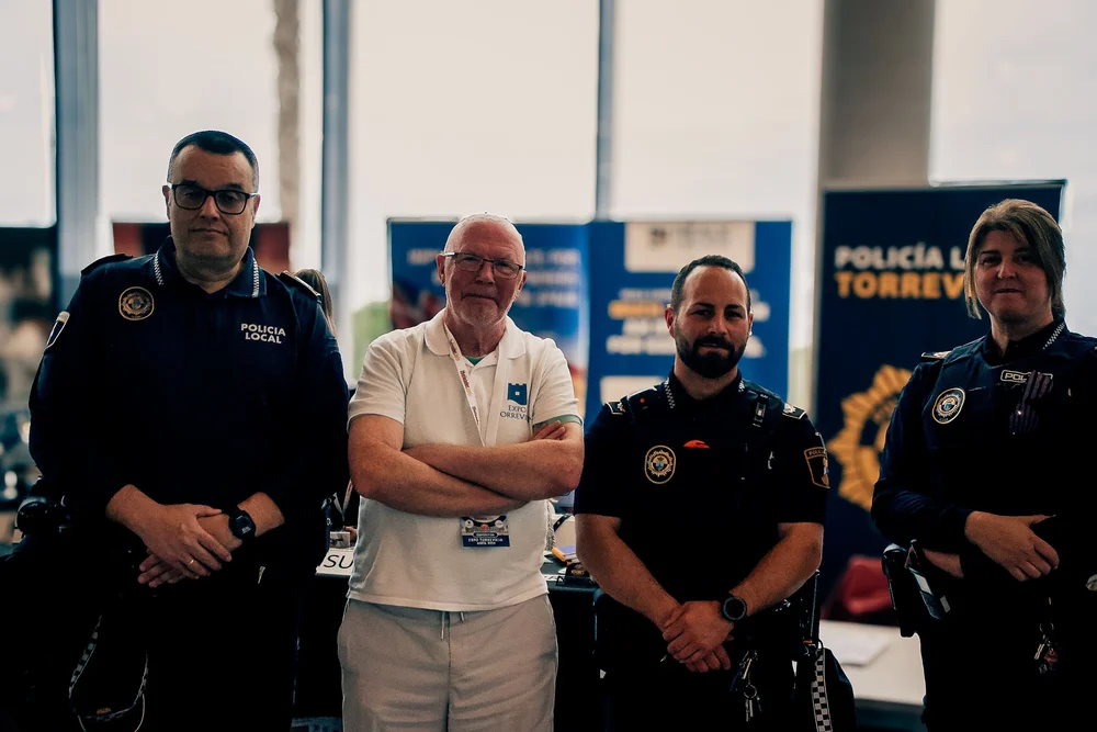Policía Local de Torrevieja officers and organizer at their official information stand