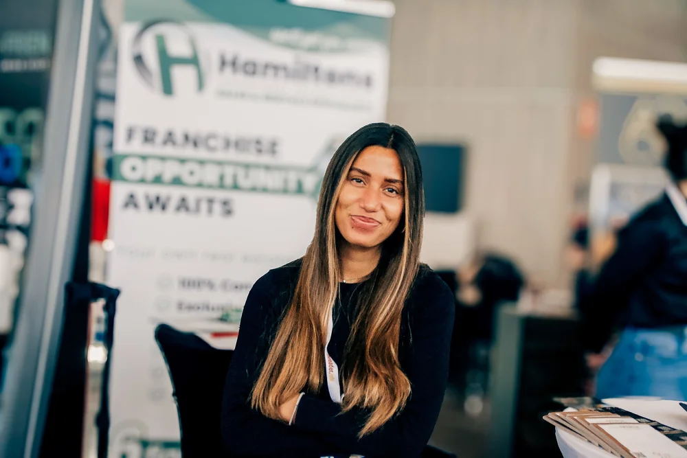 Hamiltons sales and rentals stand offering real estate franchise opportunities